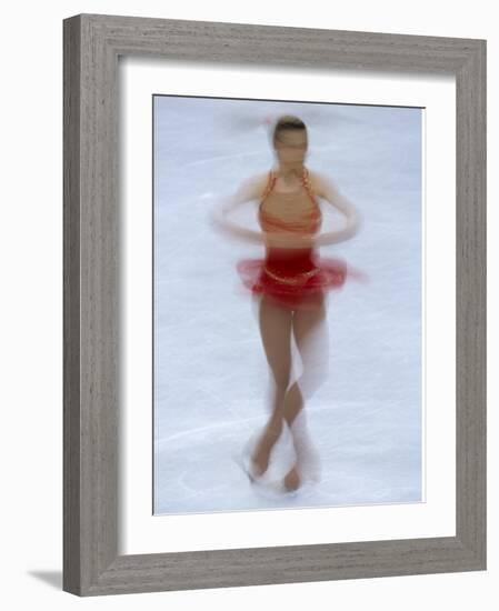 Female Figure Skater Preforming a Spin-null-Framed Photographic Print