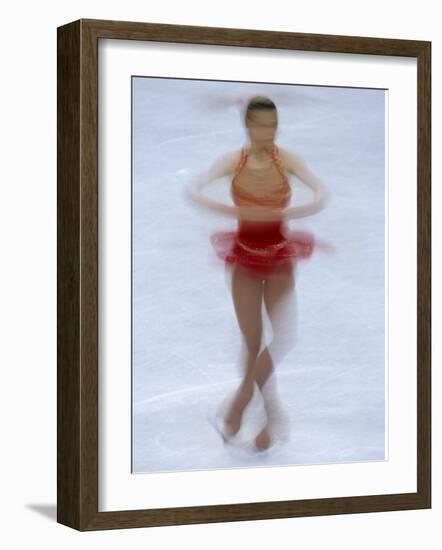 Female Figure Skater Preforming a Spin-null-Framed Photographic Print