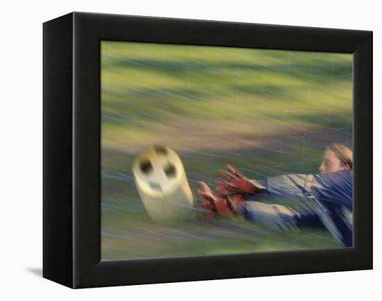 Female Goalie Attempting to Stop a Soccer Ball-null-Framed Premier Image Canvas