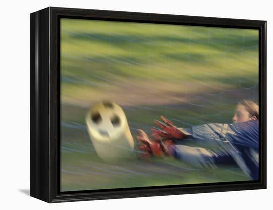 Female Goalie Attempting to Stop a Soccer Ball-null-Framed Premier Image Canvas