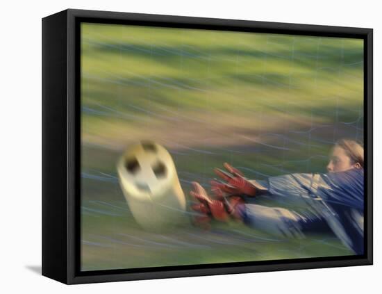 Female Goalie Attempting to Stop a Soccer Ball-null-Framed Premier Image Canvas