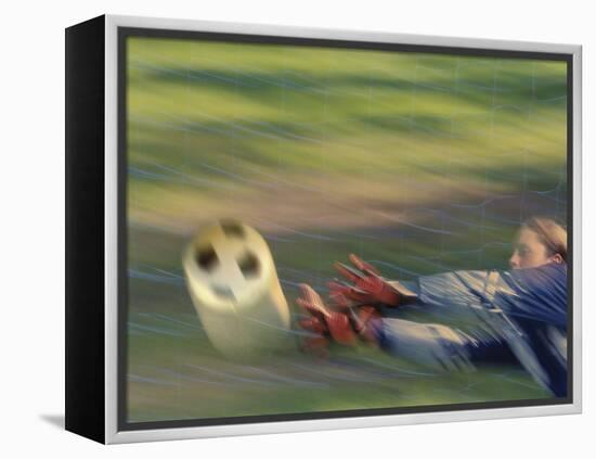 Female Goalie Attempting to Stop a Soccer Ball-null-Framed Premier Image Canvas