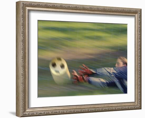 Female Goalie Attempting to Stop a Soccer Ball-null-Framed Photographic Print