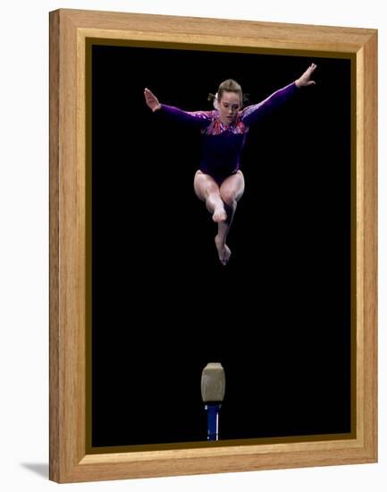 Female Gymnast Performing on the Balance Beam-null-Framed Premier Image Canvas