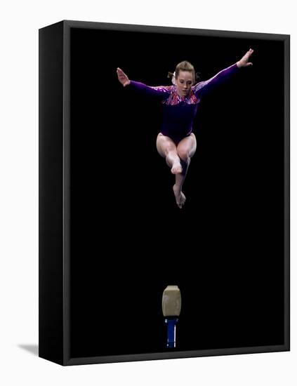 Female Gymnast Performing on the Balance Beam-null-Framed Premier Image Canvas