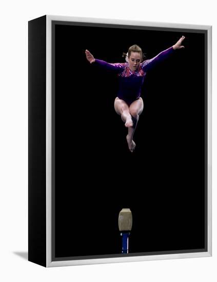 Female Gymnast Performing on the Balance Beam-null-Framed Premier Image Canvas