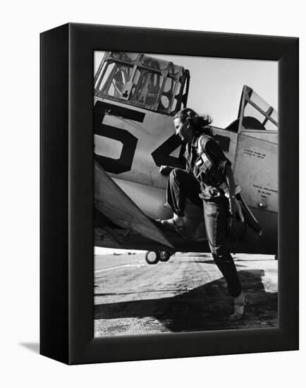 Female Pilot of the Us Women's Air Force Service Posed with Her Leg Up on the Wing of an Airplane-Peter Stackpole-Framed Premier Image Canvas