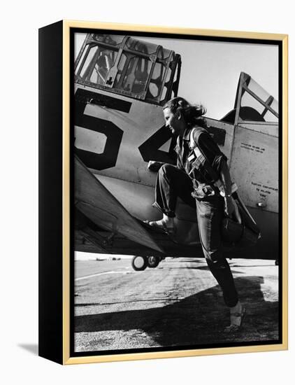 Female Pilot of the Us Women's Air Force Service Posed with Her Leg Up on the Wing of an Airplane-Peter Stackpole-Framed Premier Image Canvas