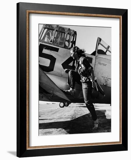 Female Pilot of the Us Women's Air Force Service Posed with Her Leg Up on the Wing of an Airplane-Peter Stackpole-Framed Premium Photographic Print