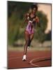 Female Runner Competing in a Track Race-null-Mounted Photographic Print