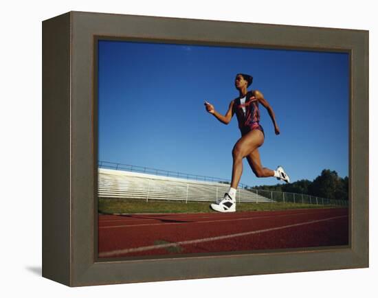 Female Runner Training on the Track-null-Framed Premier Image Canvas