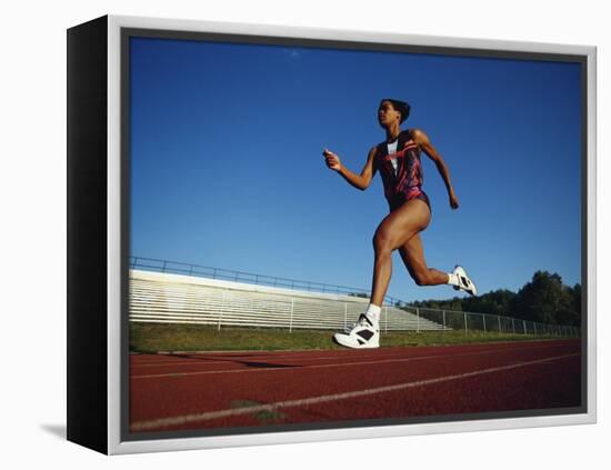 Female Runner Training on the Track-null-Framed Premier Image Canvas