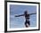 Female Runner Victorious at the Finish Line in a Track Race-null-Framed Photographic Print