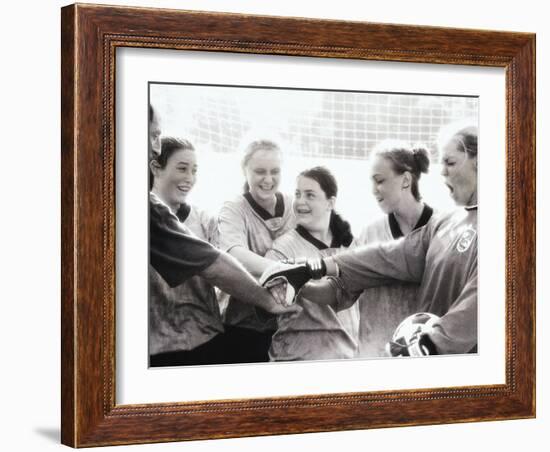 Female Soccer Team with Their Hands Together-null-Framed Photographic Print