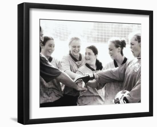 Female Soccer Team with Their Hands Together-null-Framed Photographic Print