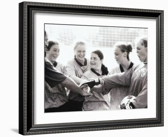 Female Soccer Team with Their Hands Together-null-Framed Photographic Print