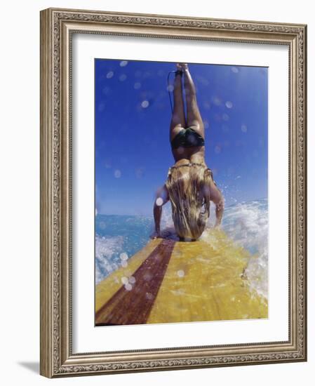 Female Surfer Doing a Headstand on a Surfboard-null-Framed Photographic Print