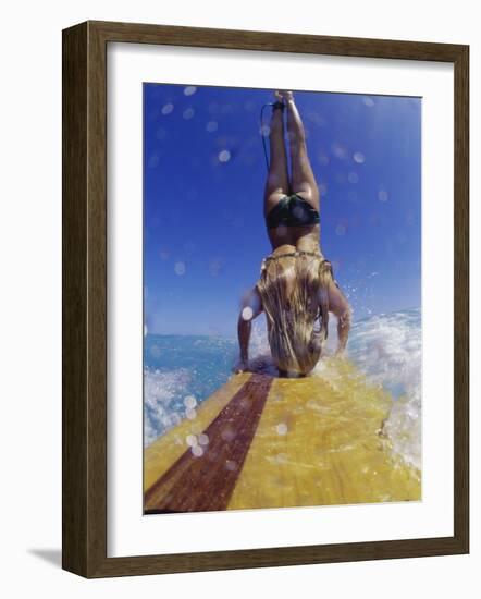 Female Surfer Doing a Headstand on a Surfboard-null-Framed Photographic Print