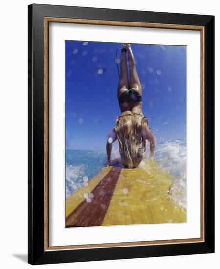 Female Surfer Doing a Headstand on a Surfboard-null-Framed Photographic Print