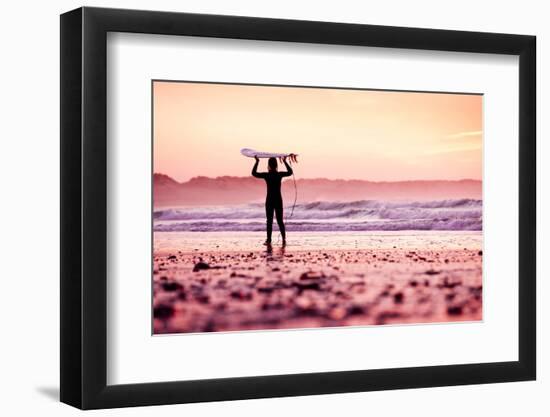 Female Surfer on the Beach at the Sunset-iko-Framed Photographic Print