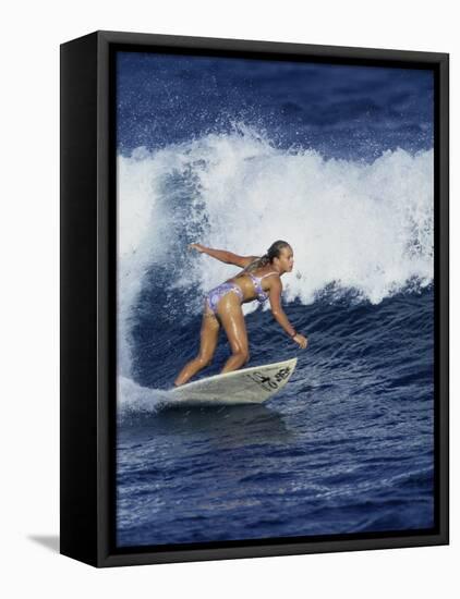 Female Surfer Riding a Wave-null-Framed Premier Image Canvas