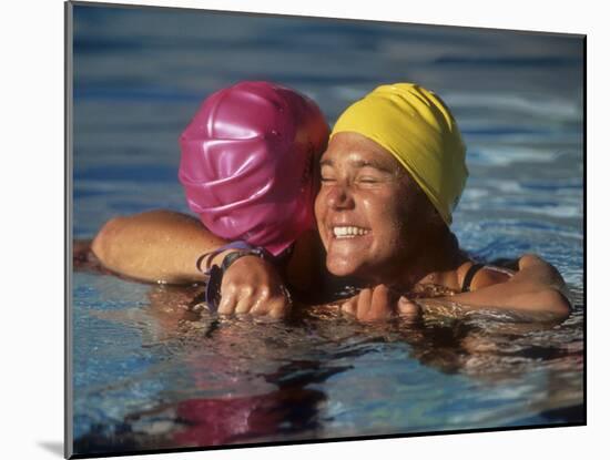 Female Swimmers Reacts to Victory-null-Mounted Photographic Print