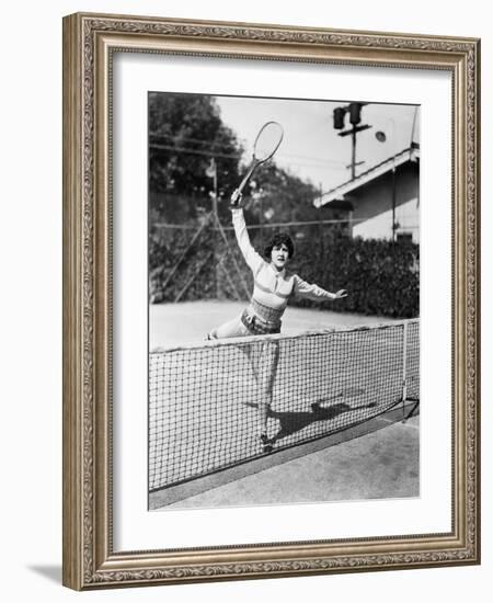 Female Tennis Player Reaching for Shot-null-Framed Photo