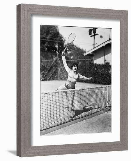 Female Tennis Player Reaching for Shot-null-Framed Photo