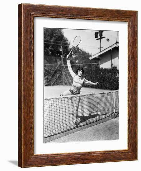 Female Tennis Player Reaching for Shot-null-Framed Photo