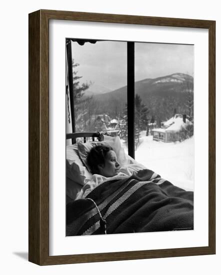 Female Tuberculosis Patient Lying under an Electric Blanket in Bed on Large Porch-Alfred Eisenstaedt-Framed Photographic Print