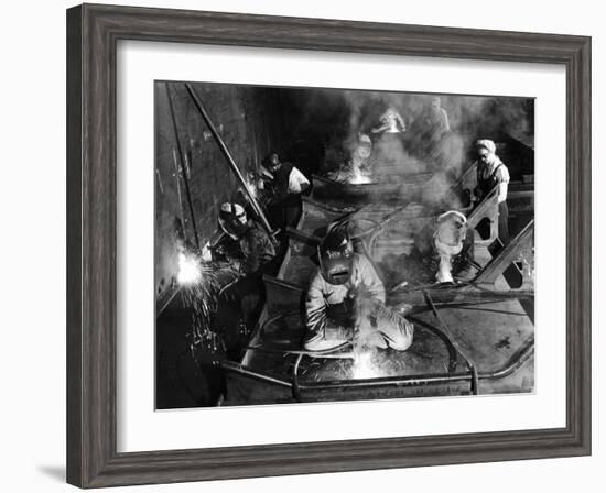 Female Welders Welding Seams on Deck Section of an Aircraft Carrier under Construction at Shipyard-Margaret Bourke-White-Framed Premium Photographic Print