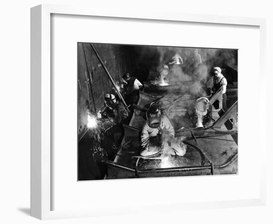 Female Welders Welding Seams on Deck Section of an Aircraft Carrier under Construction at Shipyard-Margaret Bourke-White-Framed Premium Photographic Print