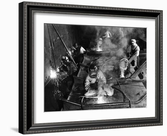 Female Welders Welding Seams on Deck Section of an Aircraft Carrier under Construction at Shipyard-Margaret Bourke-White-Framed Premium Photographic Print