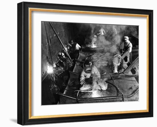 Female Welders Welding Seams on Deck Section of an Aircraft Carrier under Construction at Shipyard-Margaret Bourke-White-Framed Premium Photographic Print