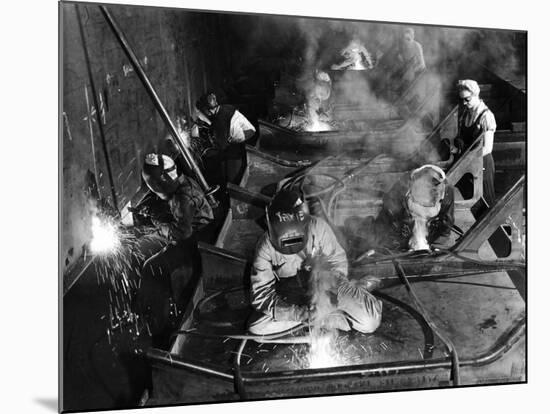 Female Welders Welding Seams on Deck Section of an Aircraft Carrier under Construction at Shipyard-Margaret Bourke-White-Mounted Premium Photographic Print
