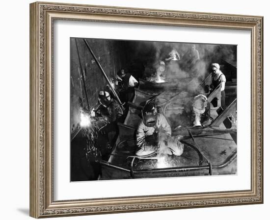 Female Welders Welding Seams on Deck Section of an Aircraft Carrier under Construction at Shipyard-Margaret Bourke-White-Framed Photographic Print