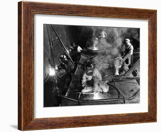 Female Welders Welding Seams on Deck Section of an Aircraft Carrier under Construction at Shipyard-Margaret Bourke-White-Framed Photographic Print