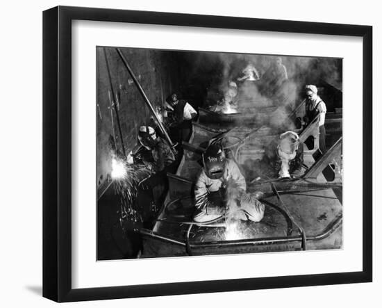 Female Welders Welding Seams on Deck Section of an Aircraft Carrier under Construction at Shipyard-Margaret Bourke-White-Framed Photographic Print