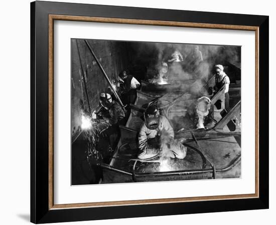 Female Welders Welding Seams on Deck Section of an Aircraft Carrier under Construction at Shipyard-Margaret Bourke-White-Framed Photographic Print