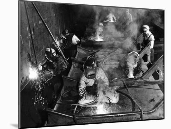 Female Welders Welding Seams on Deck Section of an Aircraft Carrier under Construction at Shipyard-Margaret Bourke-White-Mounted Photographic Print
