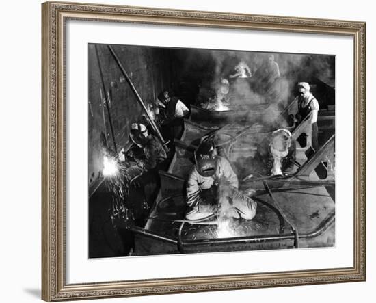 Female Welders Welding Seams on Deck Section of an Aircraft Carrier under Construction at Shipyard-Margaret Bourke-White-Framed Photographic Print