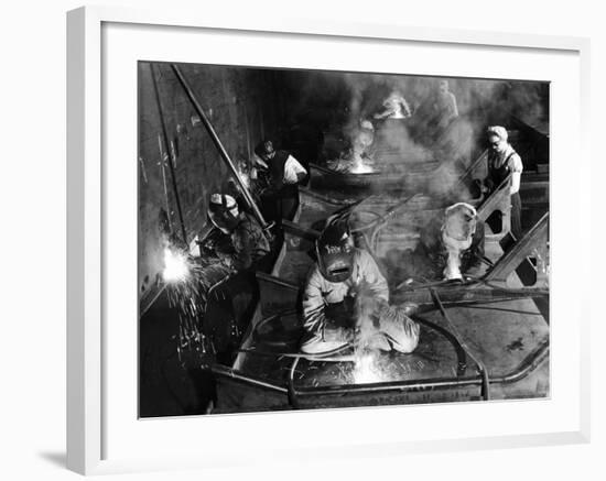 Female Welders Welding Seams on Deck Section of an Aircraft Carrier under Construction at Shipyard-Margaret Bourke-White-Framed Photographic Print