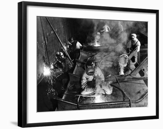 Female Welders Welding Seams on Deck Section of an Aircraft Carrier under Construction at Shipyard-Margaret Bourke-White-Framed Photographic Print