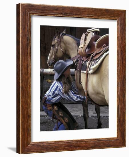 Female Wrangler Saddles Horse at Boulder River Ranch, Montana, USA-Jamie & Judy Wild-Framed Photographic Print