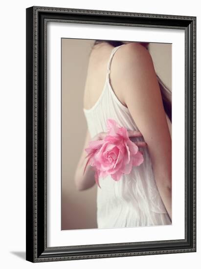 Female Youth Holding Pink Flower-Carolina Hernández-Framed Photographic Print