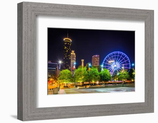 Ferris Wheel and Buildings Seen from Olympic Centennial Park at Night in Atlanta, Georgia.-Jon Bilous-Framed Photographic Print