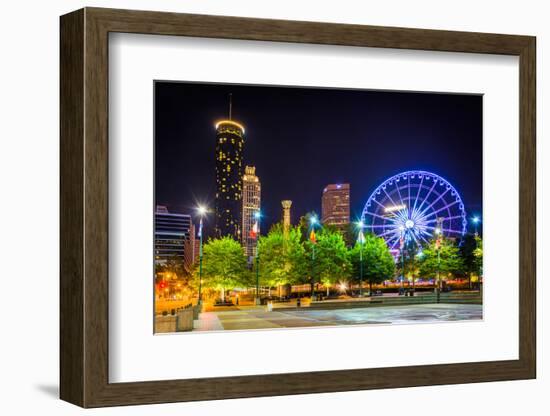 Ferris Wheel and Buildings Seen from Olympic Centennial Park at Night in Atlanta, Georgia.-Jon Bilous-Framed Photographic Print