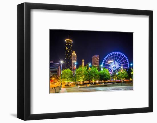 Ferris Wheel and Buildings Seen from Olympic Centennial Park at Night in Atlanta, Georgia.-Jon Bilous-Framed Photographic Print