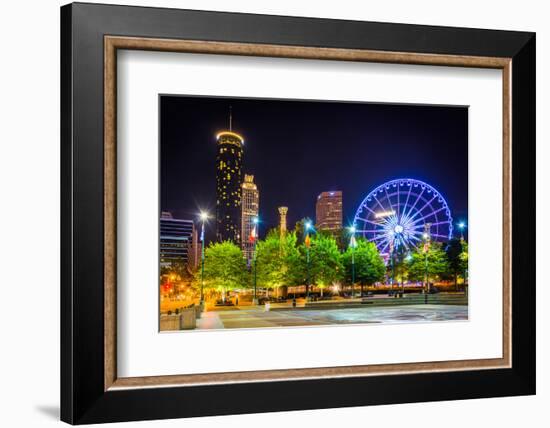 Ferris Wheel and Buildings Seen from Olympic Centennial Park at Night in Atlanta, Georgia.-Jon Bilous-Framed Photographic Print