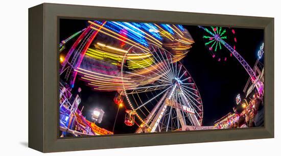 Ferris Wheel and various other funfair rides at night at Nottingham's Goose Fair, Nottingham, Notti-Frank Fell-Framed Premier Image Canvas